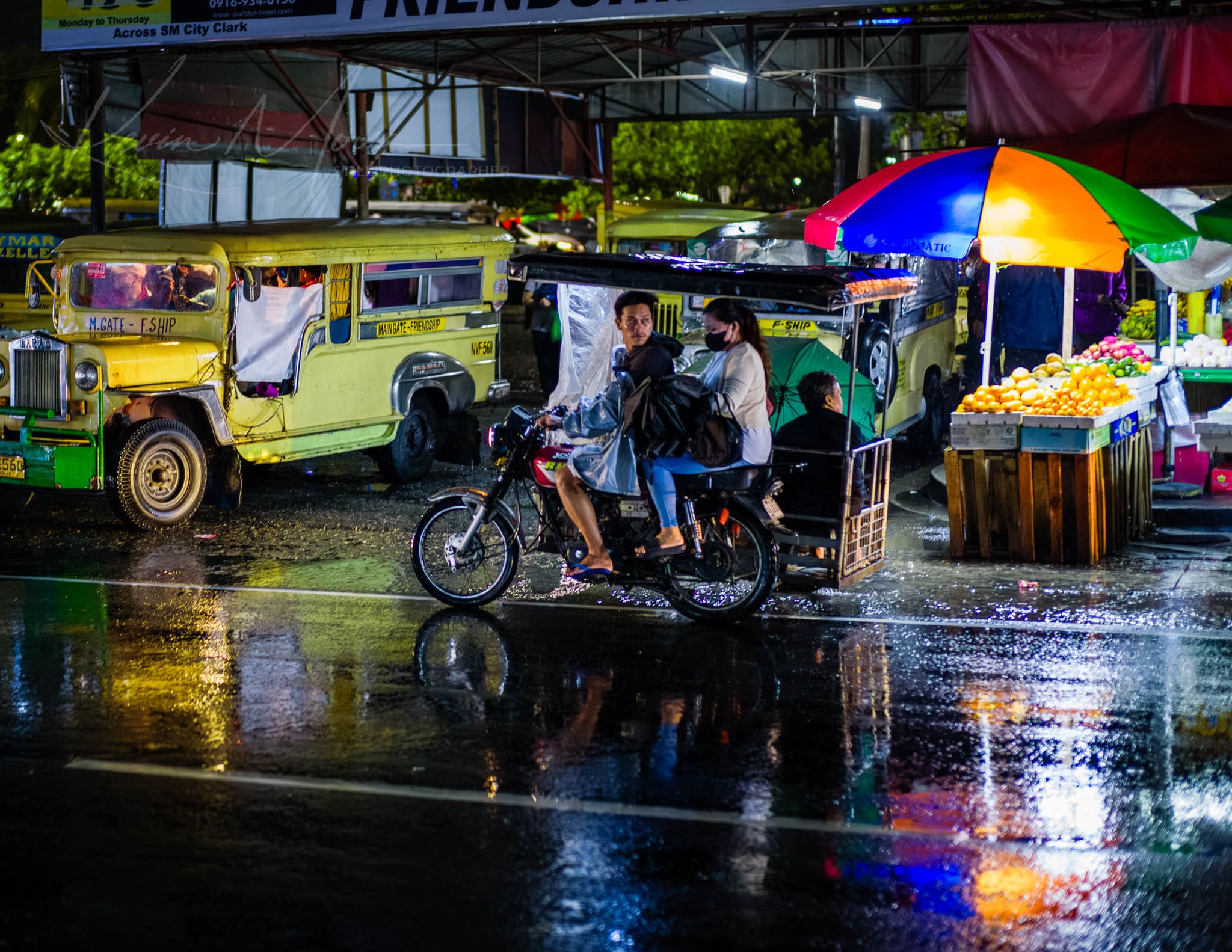 Vibrant Nightlife and Transportation on a Rainy Night in the Philippines