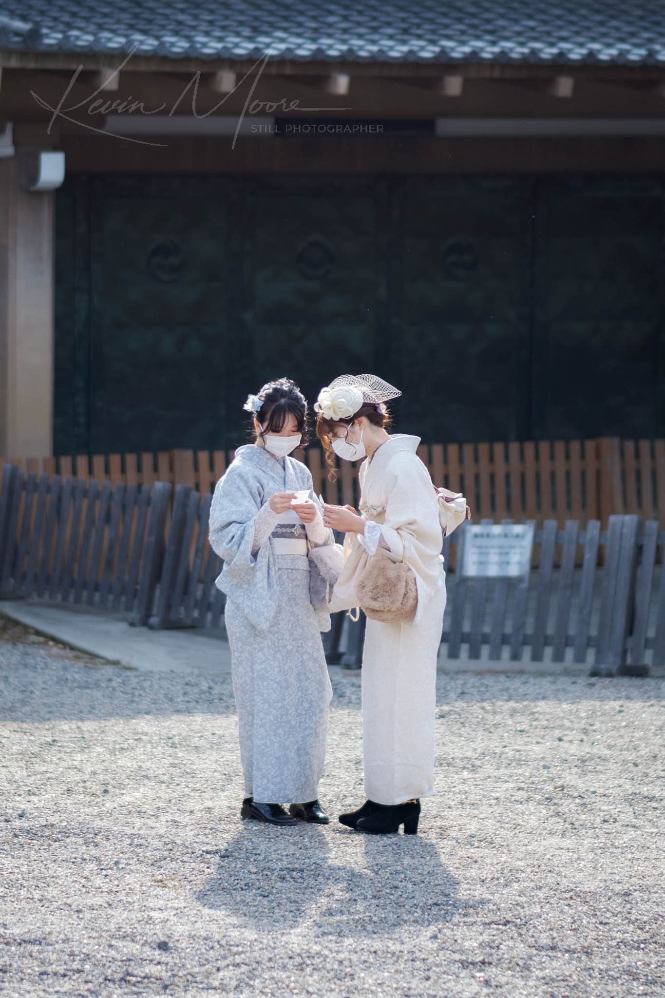 Modern and traditional blend in a conversation between two kimono-clad individuals in Japan