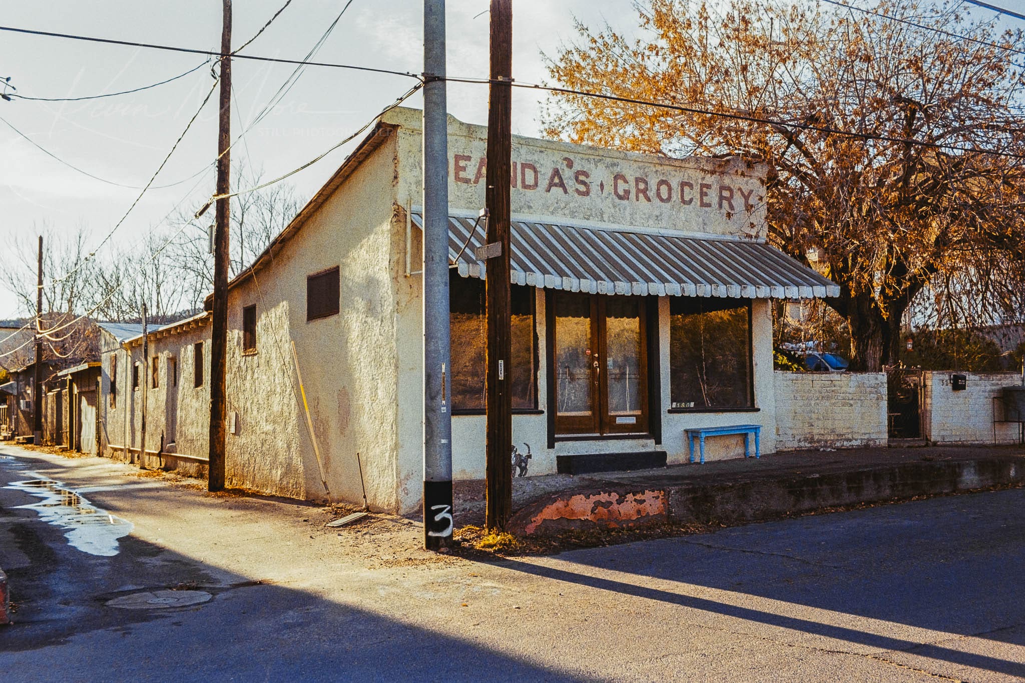 Vintage Miami Arizona Grocery Store at dusk in an aged, rustic neighborhood.